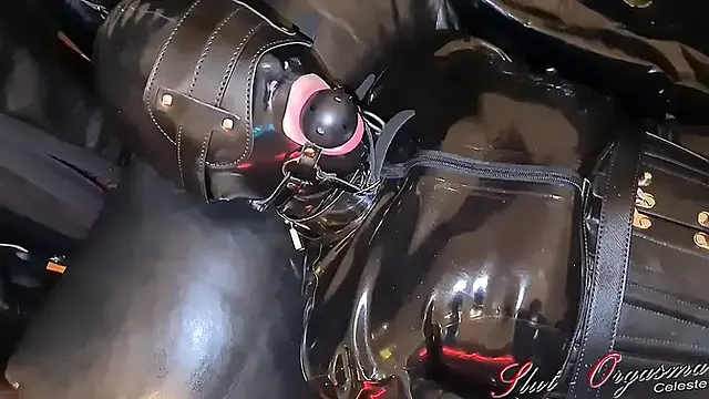 Slave slut-orgasma Celeste bound in black latex and leather pushed to a orgasm